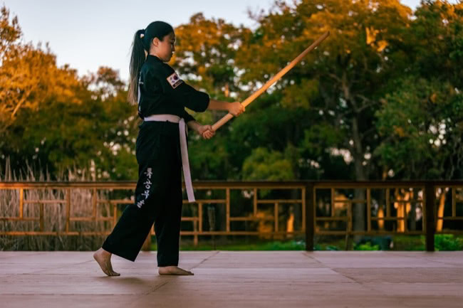 Photo of a white belt with sword