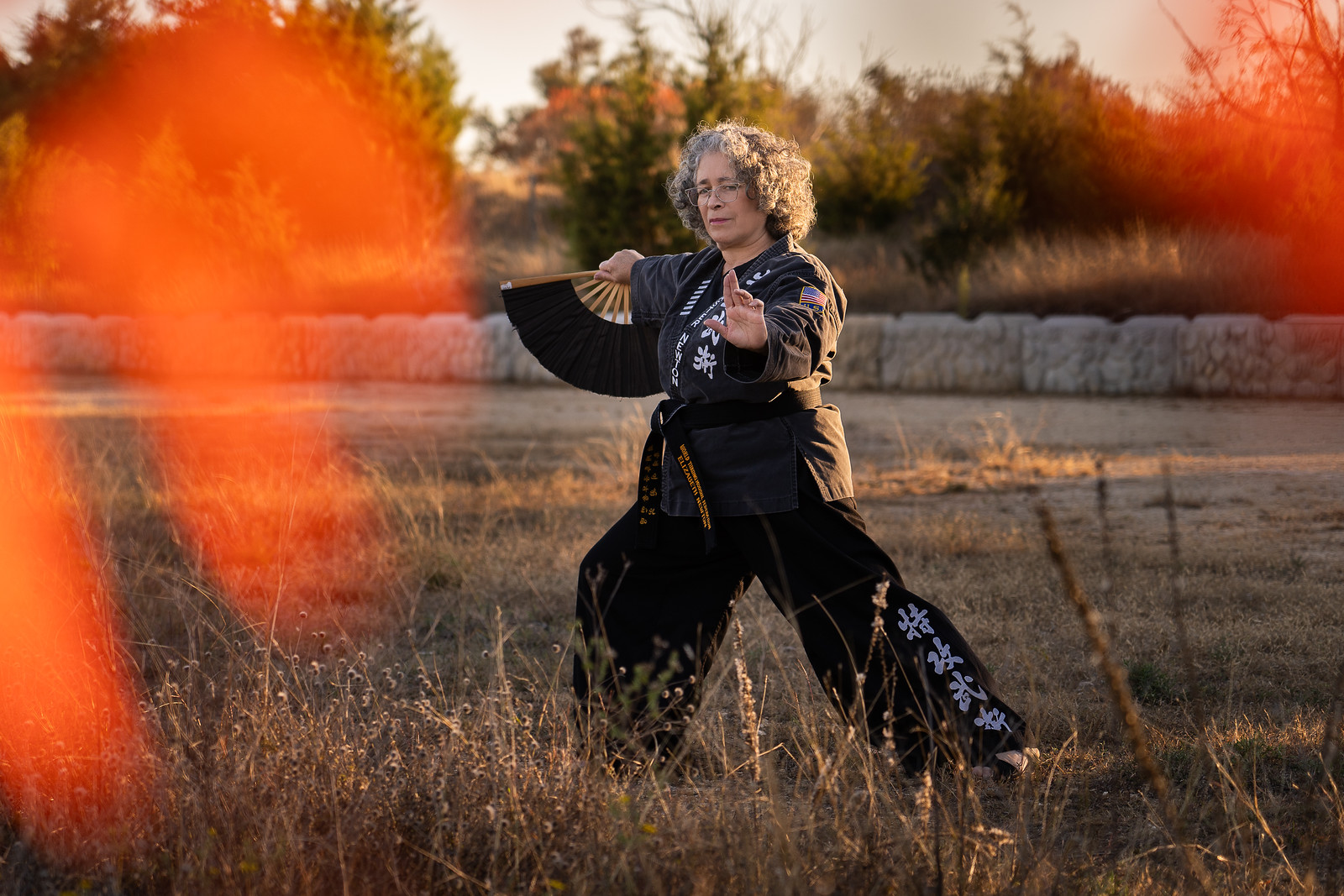 Chief Master Nell Newton performing a fan form outside